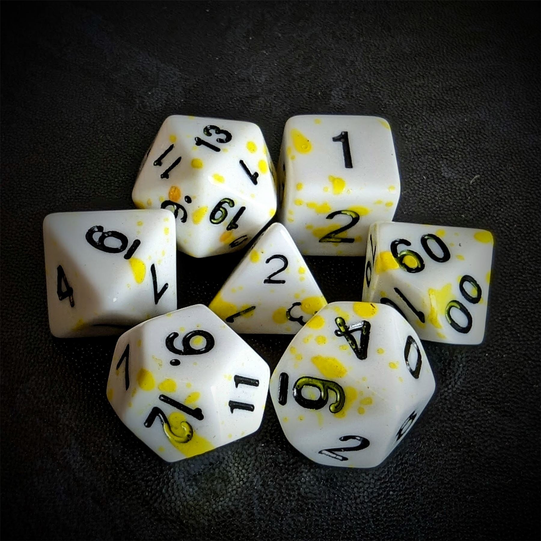 Yellow Blood Splatter on White Acrylic - 7pcs RPG Full Dice Set