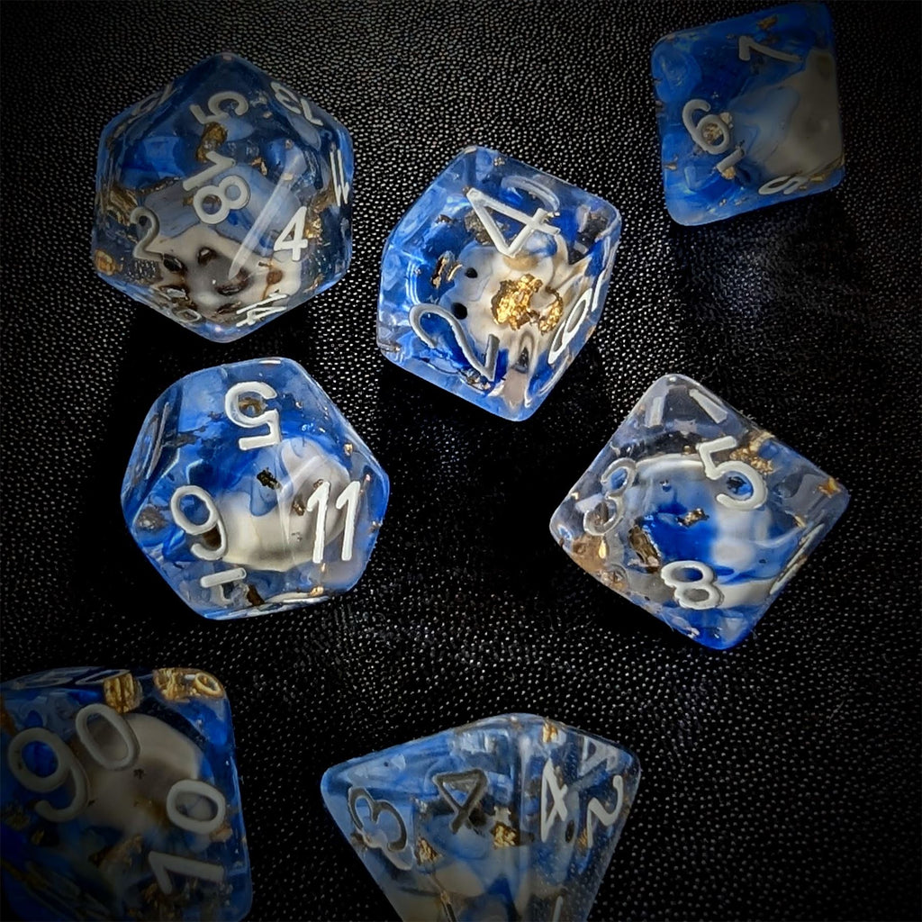 Skull & Gold Foil in Clear & Blue Resin - 7pcs RPG Full Dice Set