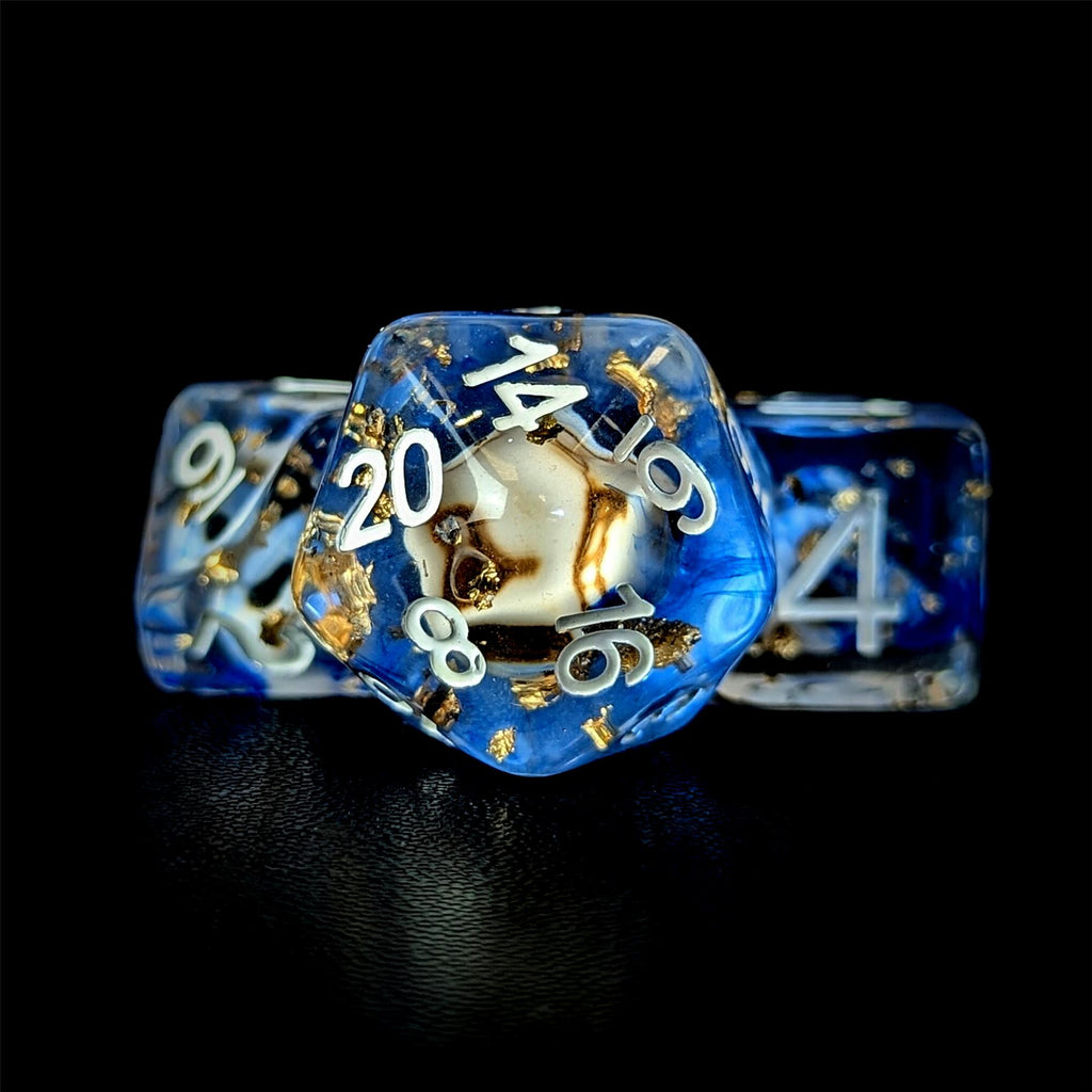 Skull & Gold Foil in Clear & Blue Resin - 7pcs RPG Full Dice Set
