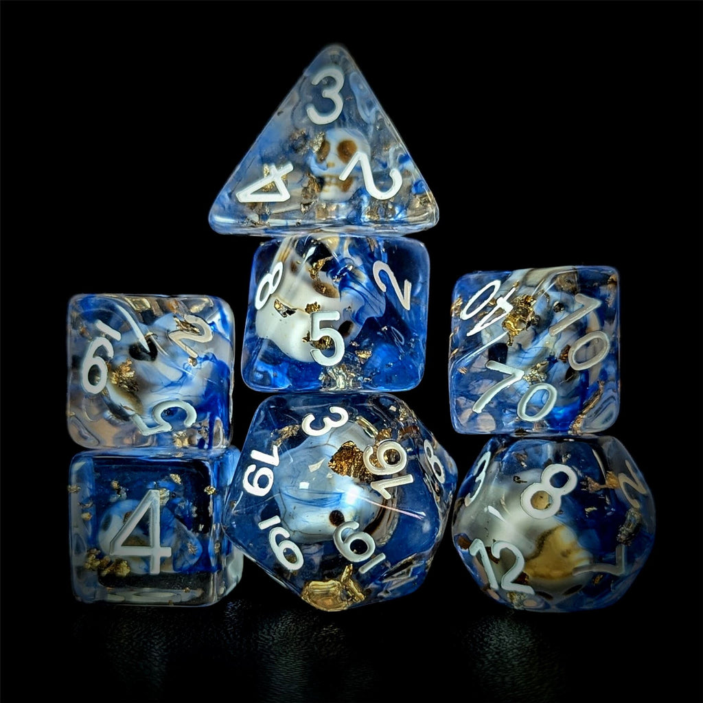 Skull & Gold Foil in Clear & Blue Resin - 7pcs RPG Full Dice Set