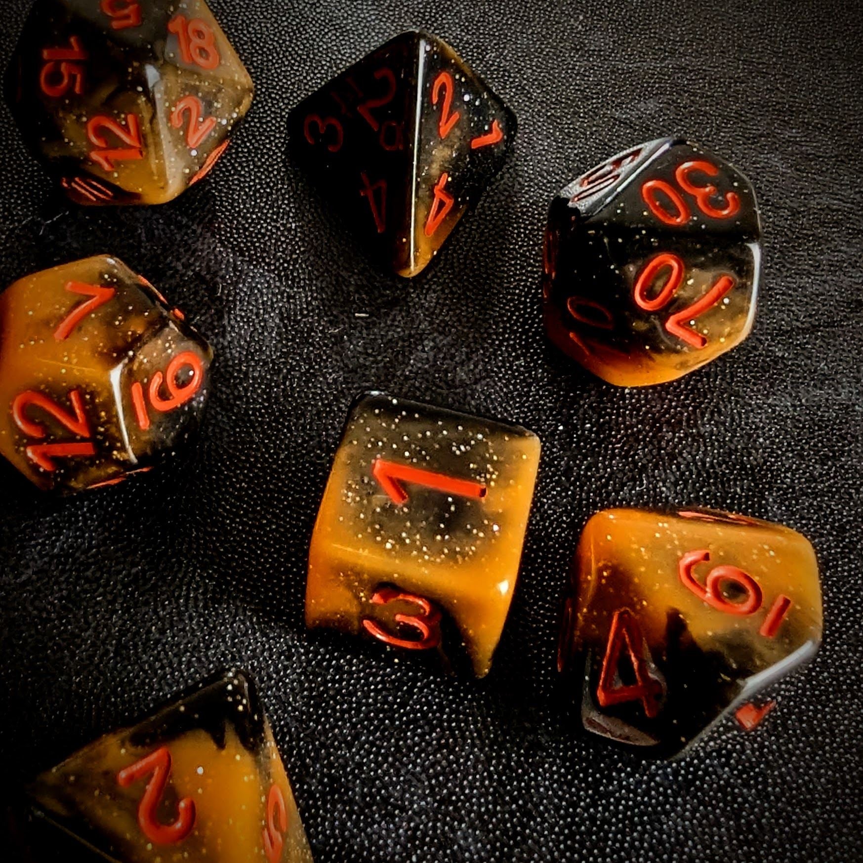Glitter in Black & Orange Acrylic - 7pcs RPG Full Dice Set