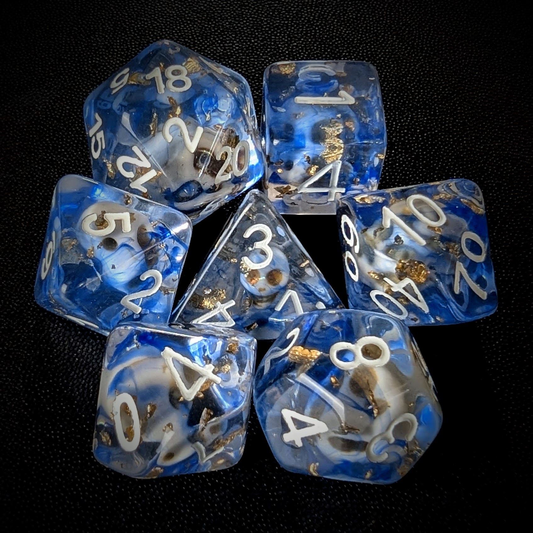 Skull & Gold Foil in Clear & Blue Resin - 7pcs RPG Full Dice Set